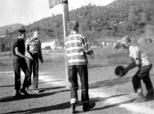 Basketball at the Elementary School: L-R: Ronnie Jones, Gary Rowe, G.M. Rainwater (?), and Ed Carey